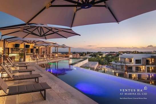 Ventus Ha rooftop infinity pool at sunset